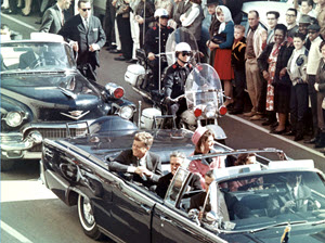 President Kennedy with his wife, Jacqueline, and Texas Governor John Connally with his wife, Nellie, in the presidential limousine, minutes before the assassination