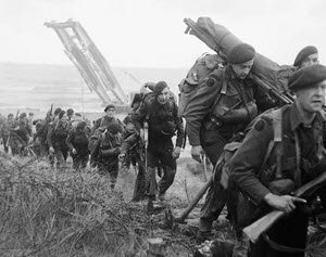 Royal Marine Commandos attached to 3rd Infantry Division move inland from Sword Beach, 6 June 1944'