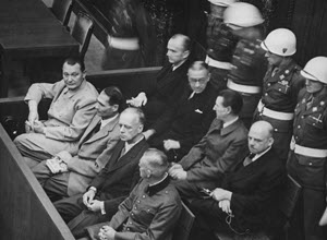 Defendants in the dock at the Nuremberg trials. The main target of the prosecution was Hermann Göring (at the left edge on the first row of benches), considered to be the most important surviving official in the Third Reich after Hitler's death'